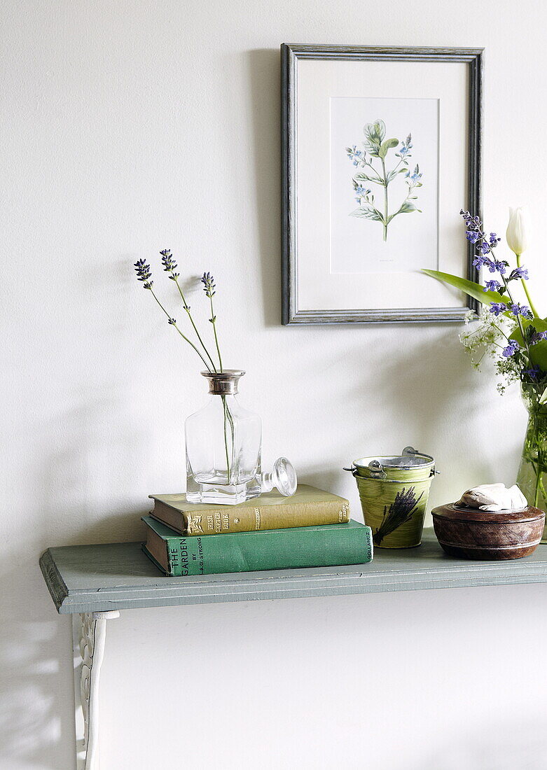 Botanical print and dried lavender with books on shelf in farmhouse, Oxfordshire, England, UK