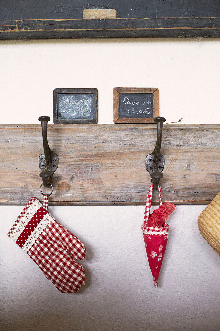 Vintage chalk boards and coat hooks in Brittany schoolhouse conversion France