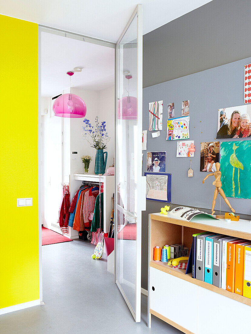 View through door with yellow wall and noticeboard in Mattenbiesstraat family home, Netherlands