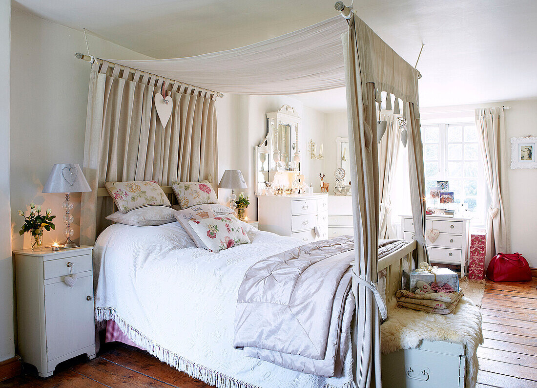 Double bed with canopy in Derbyshire farmhouse England UK