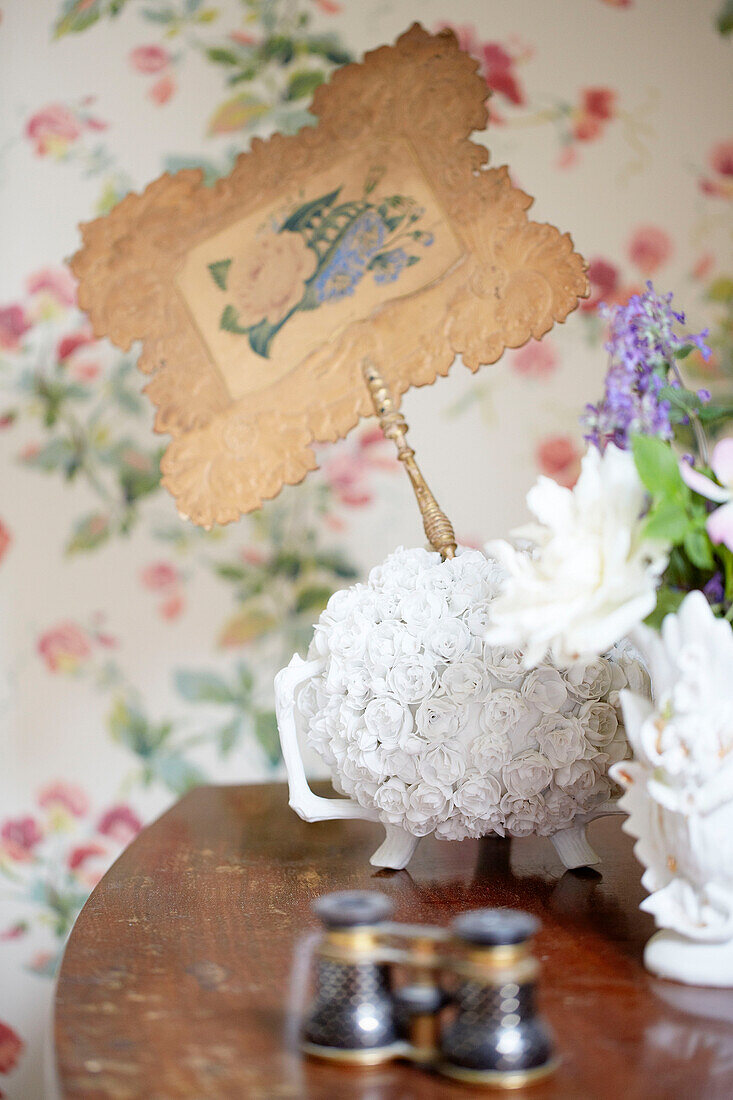 Vintage ornaments on bedside table in Oxfordshire country house England UK