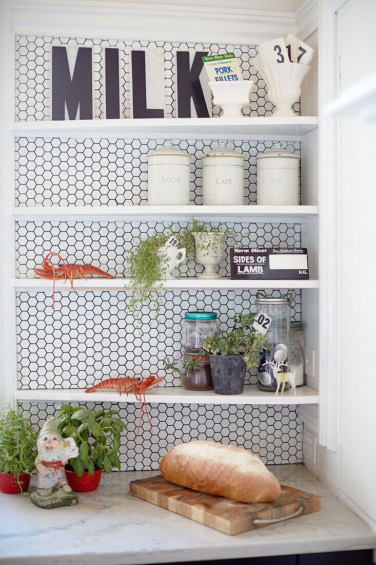 Single word 'MILK' on kitchen shelves with loaf of bread in Warkworth kitchen Auckland North Island New Zealand