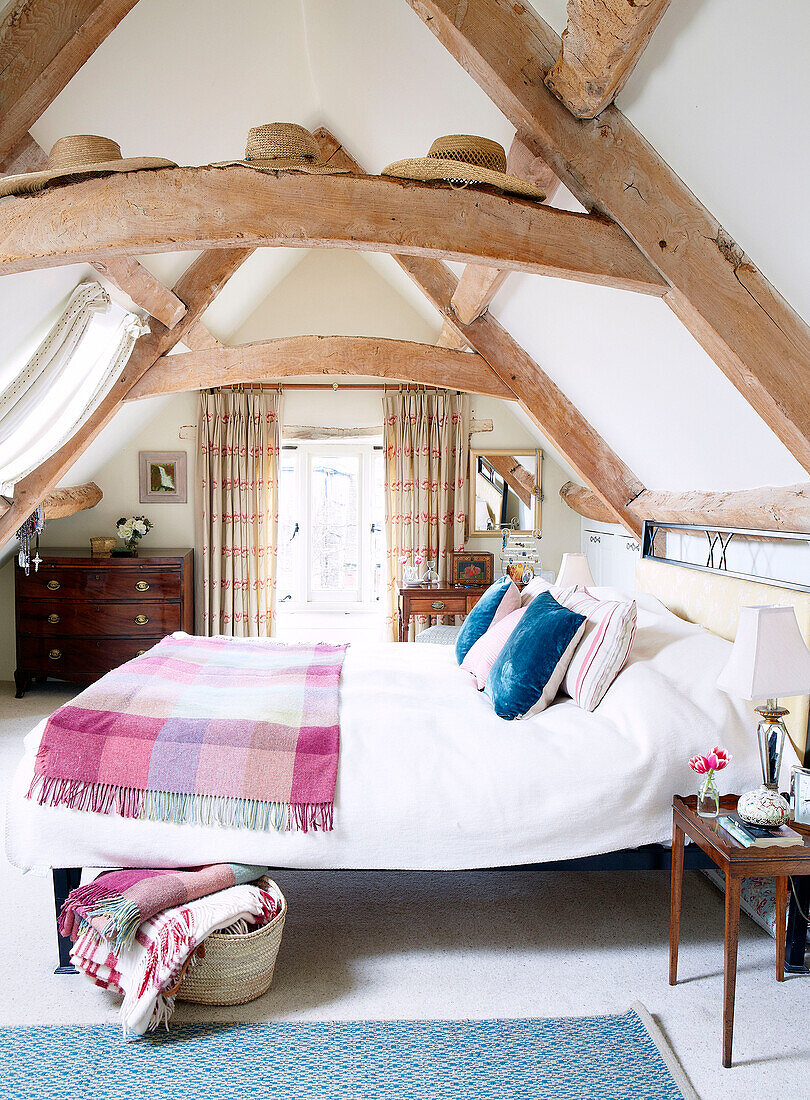 Beamed attic bedroom in Nottinghamshire barn conversion England UK