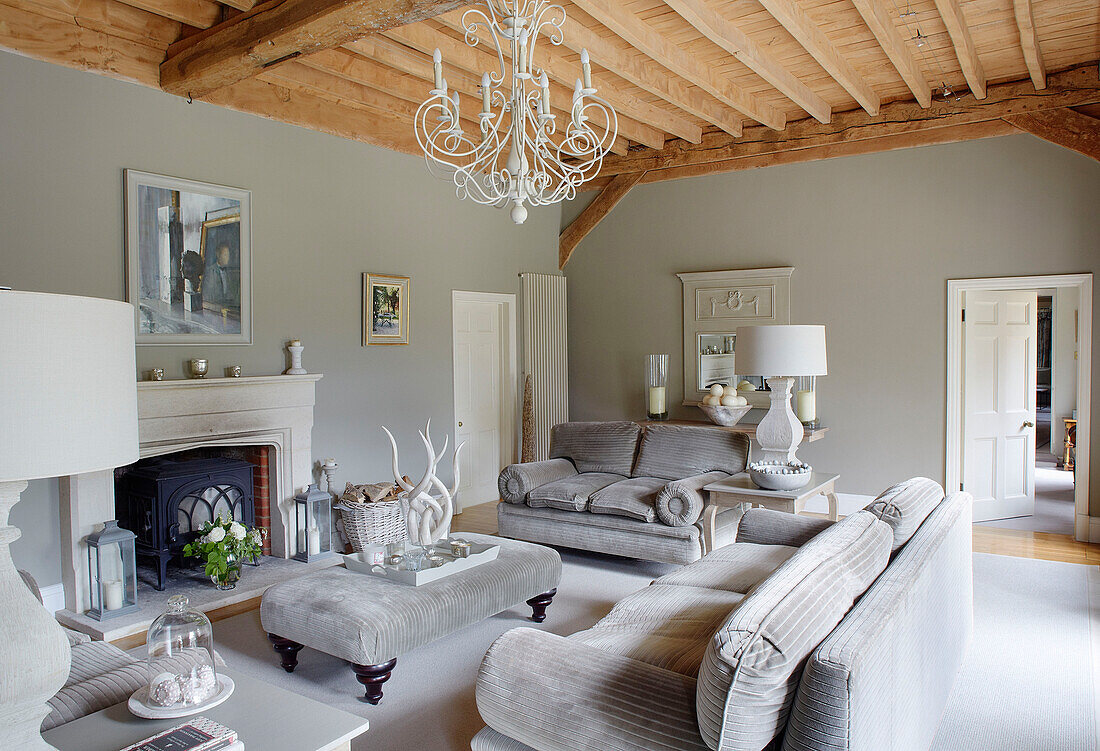 Light grey living room with corduroy sofas and ottoman footstool in Buckinghamshire home UK