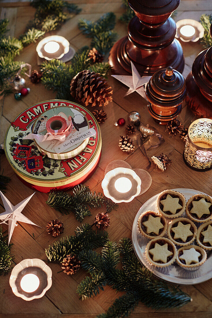 Tealights and mince pies with vintage cake tin in Oxfordshire home England UK