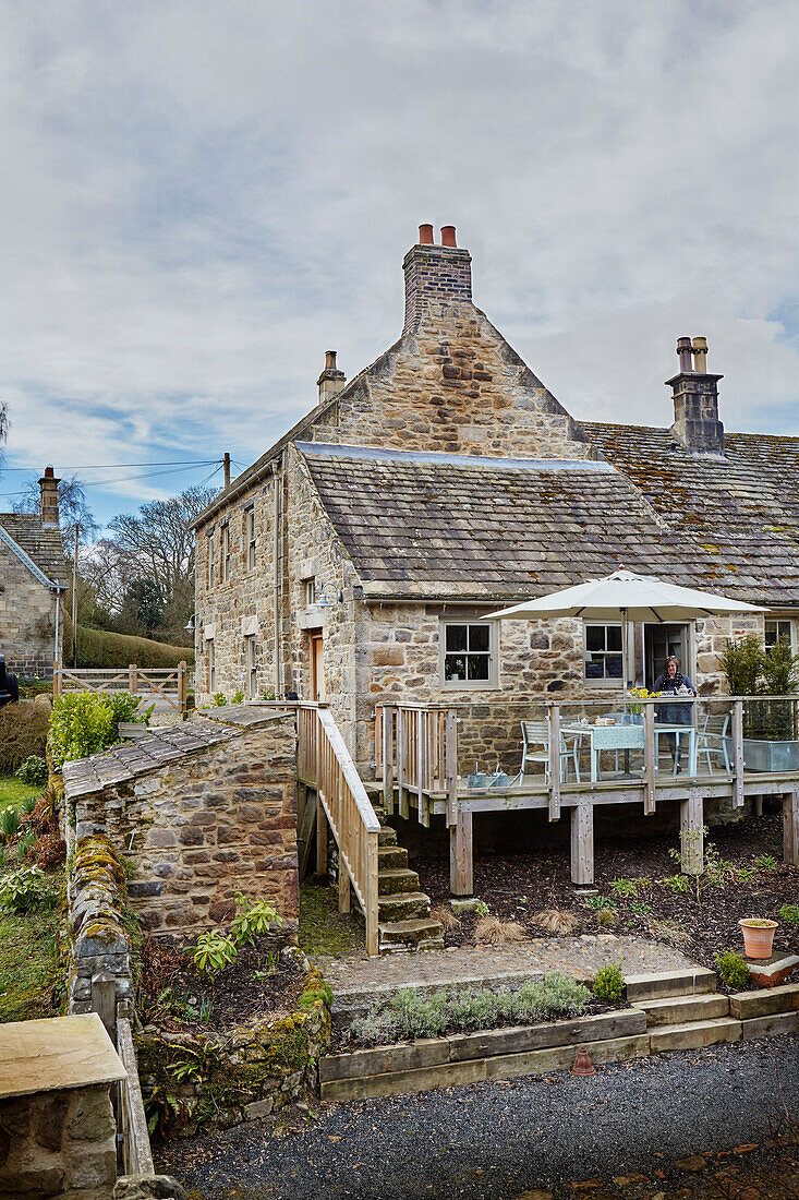 Decked terrace of Grade II listed Tudor bastle or fortified farmhouse Northumberland UK