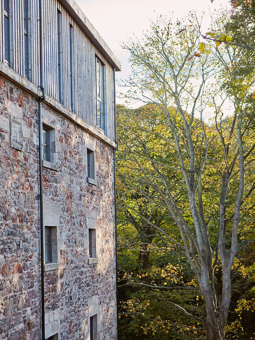 Downpipe and windows of 19th Century Grain Mill conversion Scottish Borders, UK