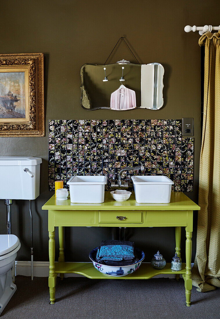 Pair of white bowls with mixer tap and splashback on lime green wash stand in Deddington home, Oxfordshire, UK