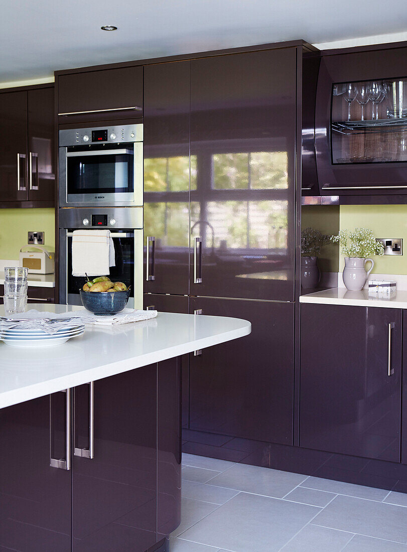 Integral oven and gloss cabinets in North Yorkshire kitchen, UK