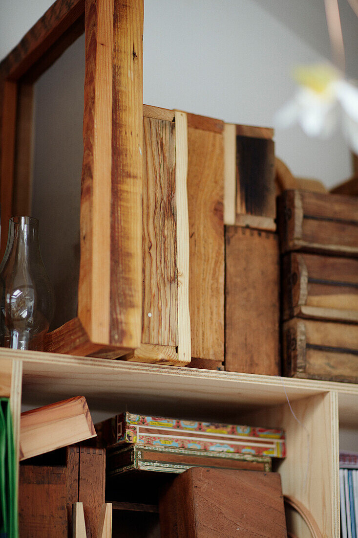 Wooden storage boxes on shelves in Gladestry studio on South Wales borders