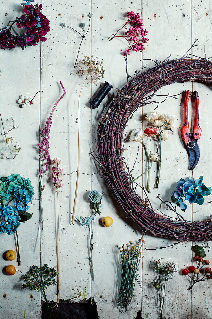 Cut flowers and tools for making a floral wreath in Radnorshire-Herefordshire borders, UK