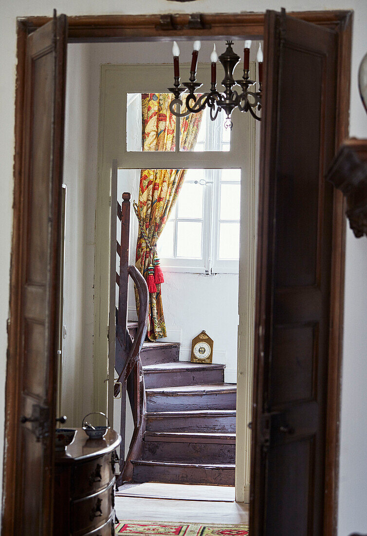 View through double doors to stairway in Foix townhouse Ariege, France