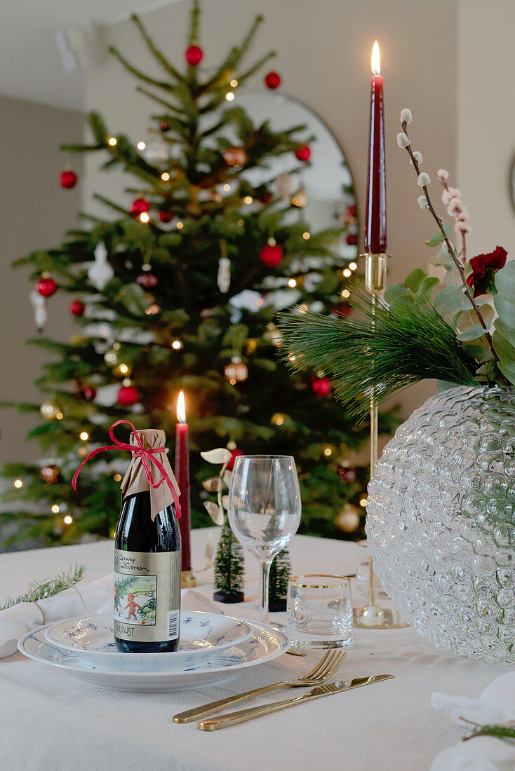 Beer bottles on table festively set for Christmas