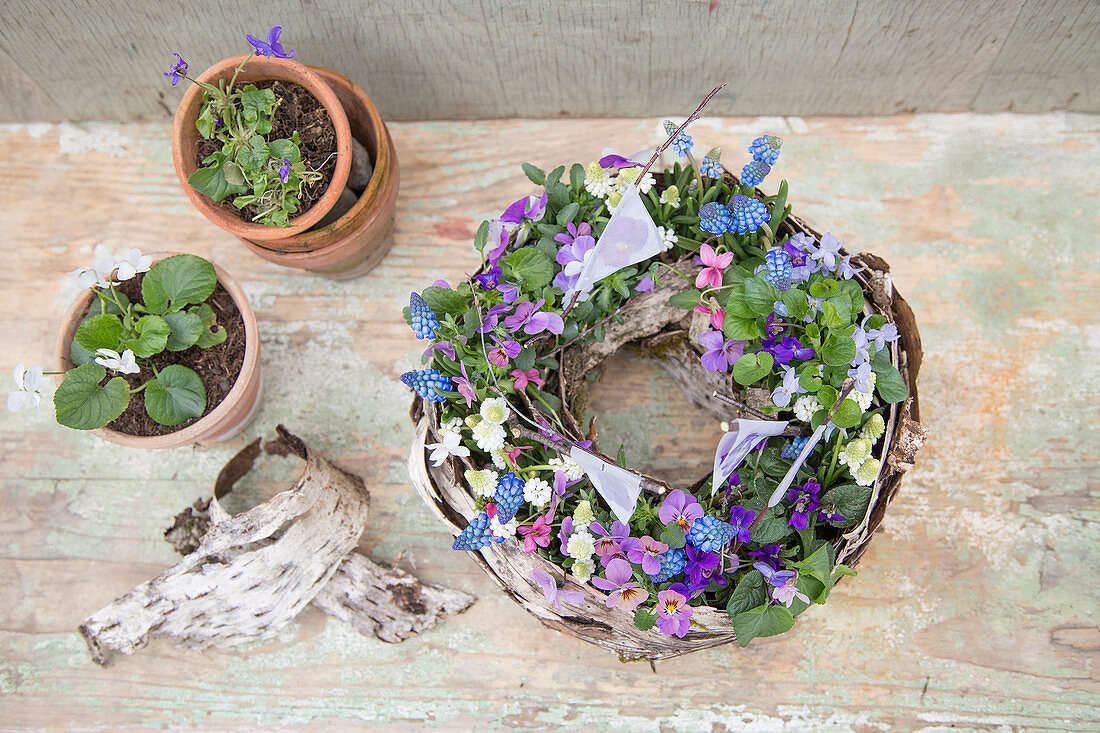 Wreath-shaped spring arrangement decorated with tiny flags