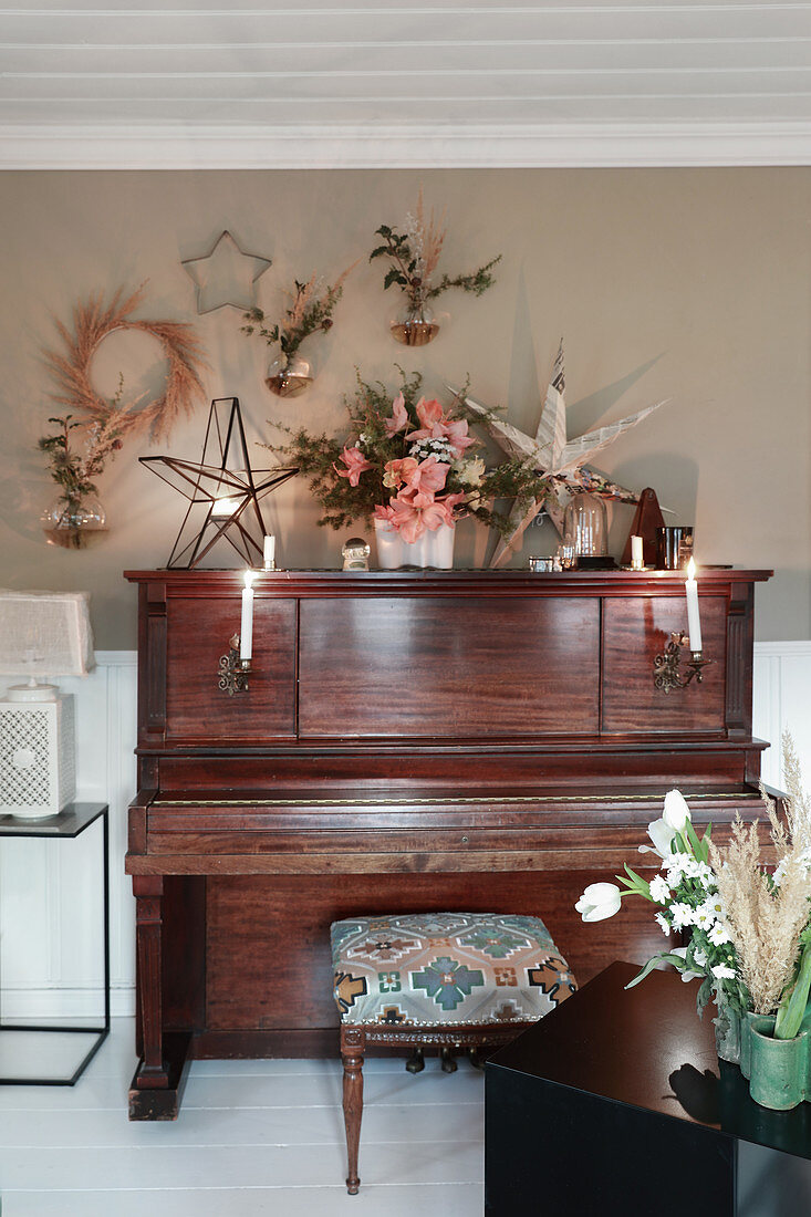 Piano surrounded by Christmas decorations