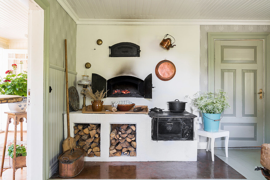 Old wood-fired stove and oven in country-house kitchen