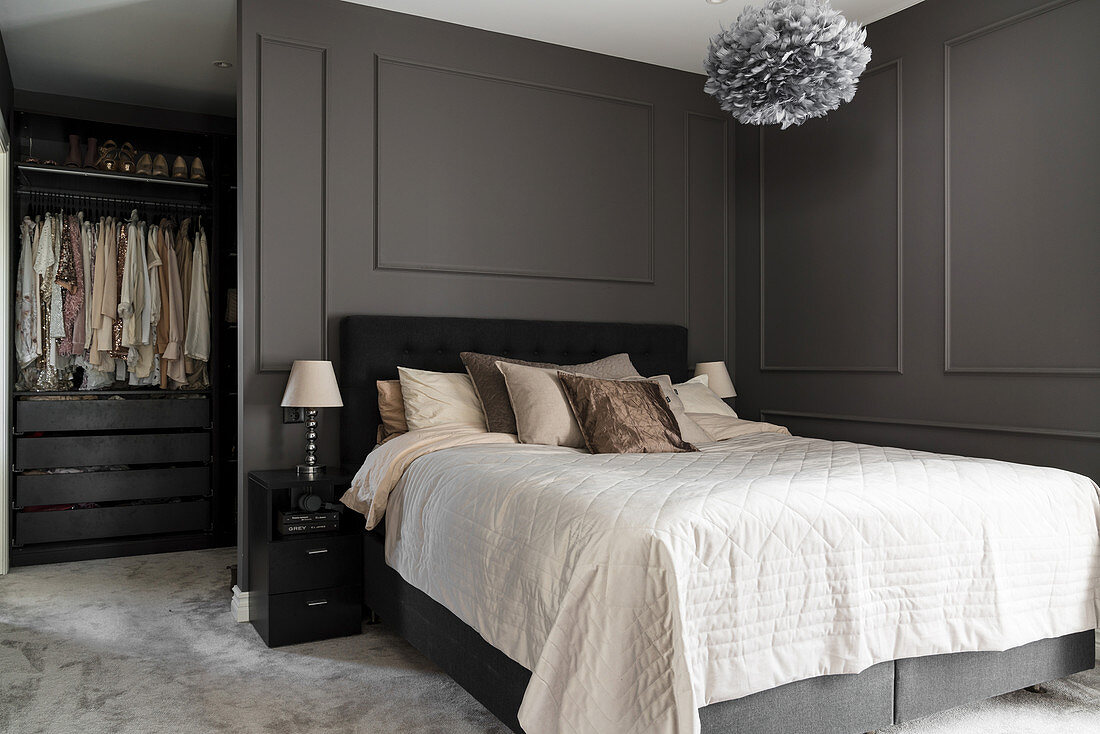 Double bed and walk-in wardrobe in elegant bedroom