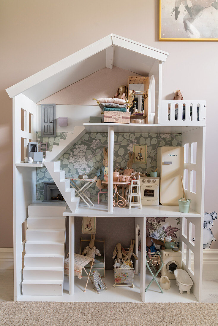 Dolls' house in girl's bedroom