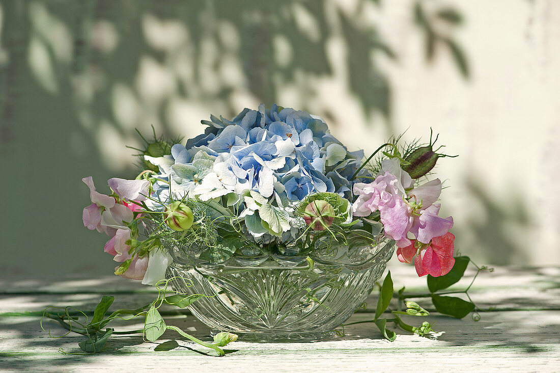 Bouquet of hydrangea, sweet peas and love-in-a-mist