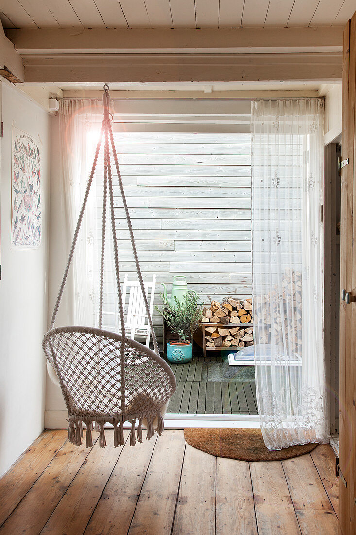 Hanging chair next to terrace door