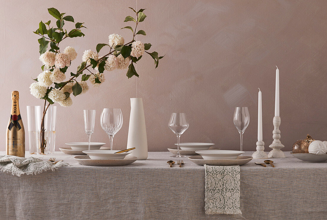 Festively set table in natural tones