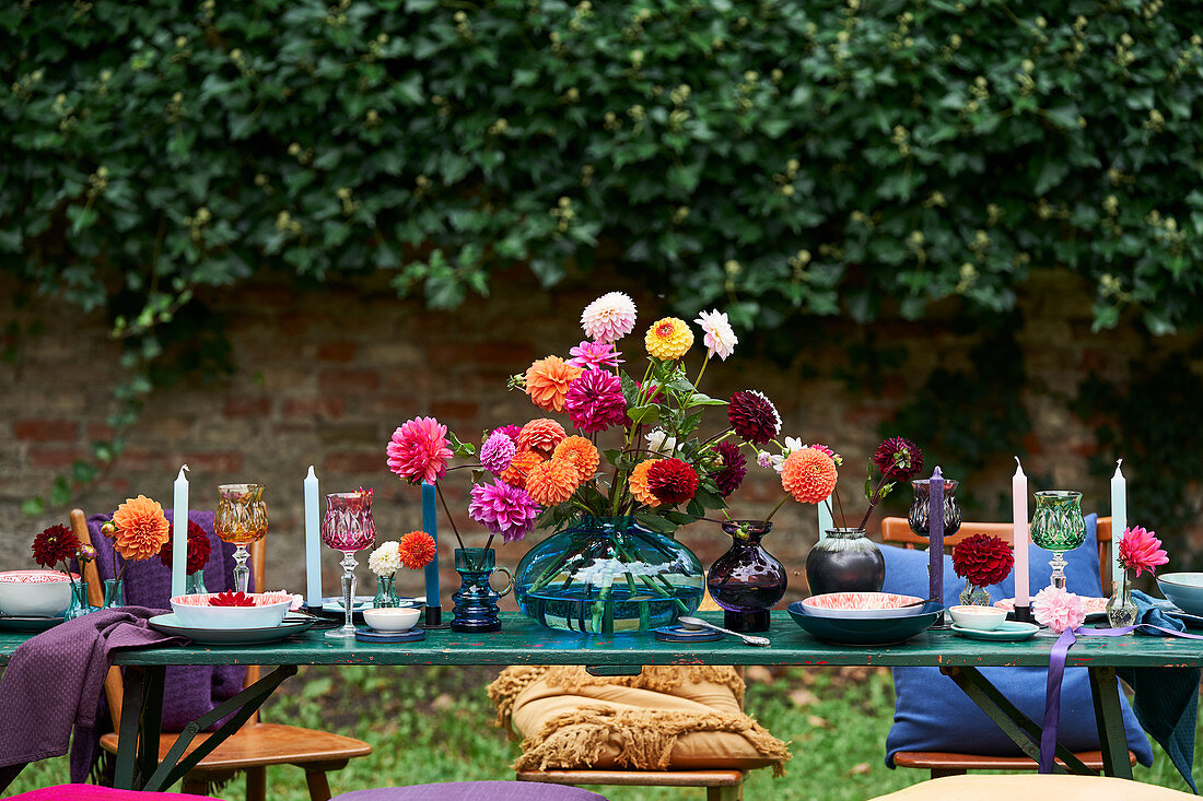 Dahlias on festively set table outdoors