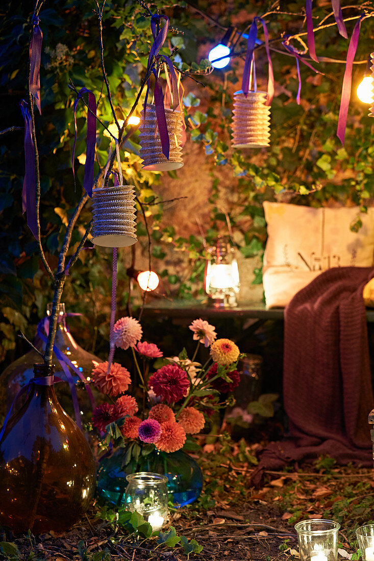 Fairy lights in romantic ivy-covered arbour at twilight