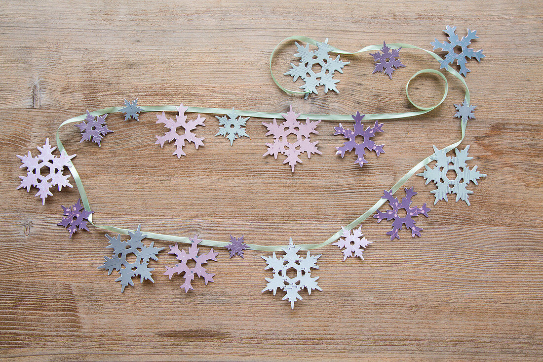 Handmade garland of paper snowflakes