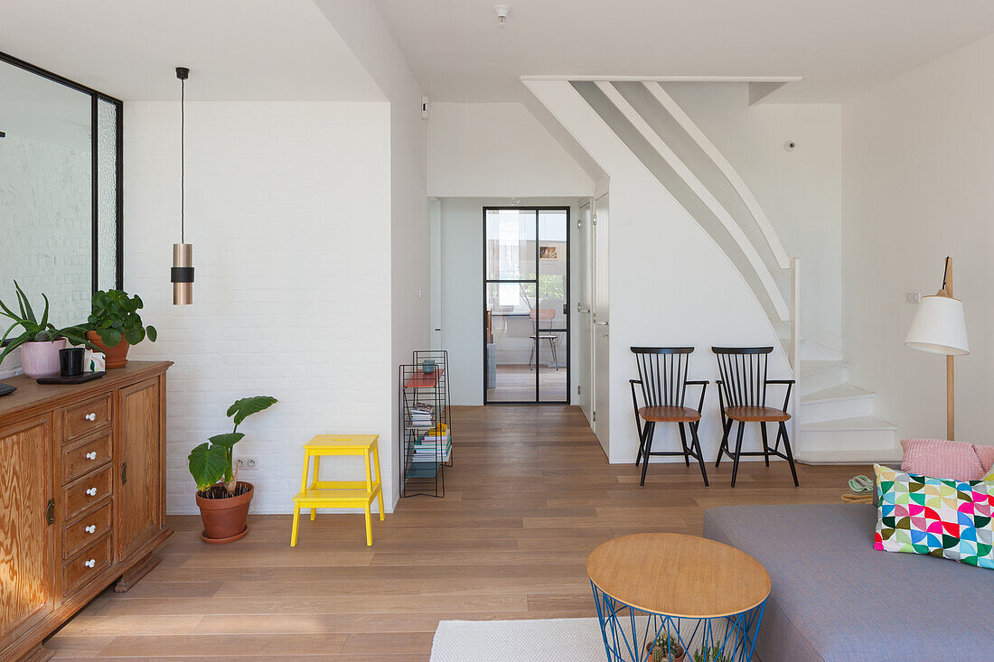 Bright living room with wooden furniture and parquet flooring