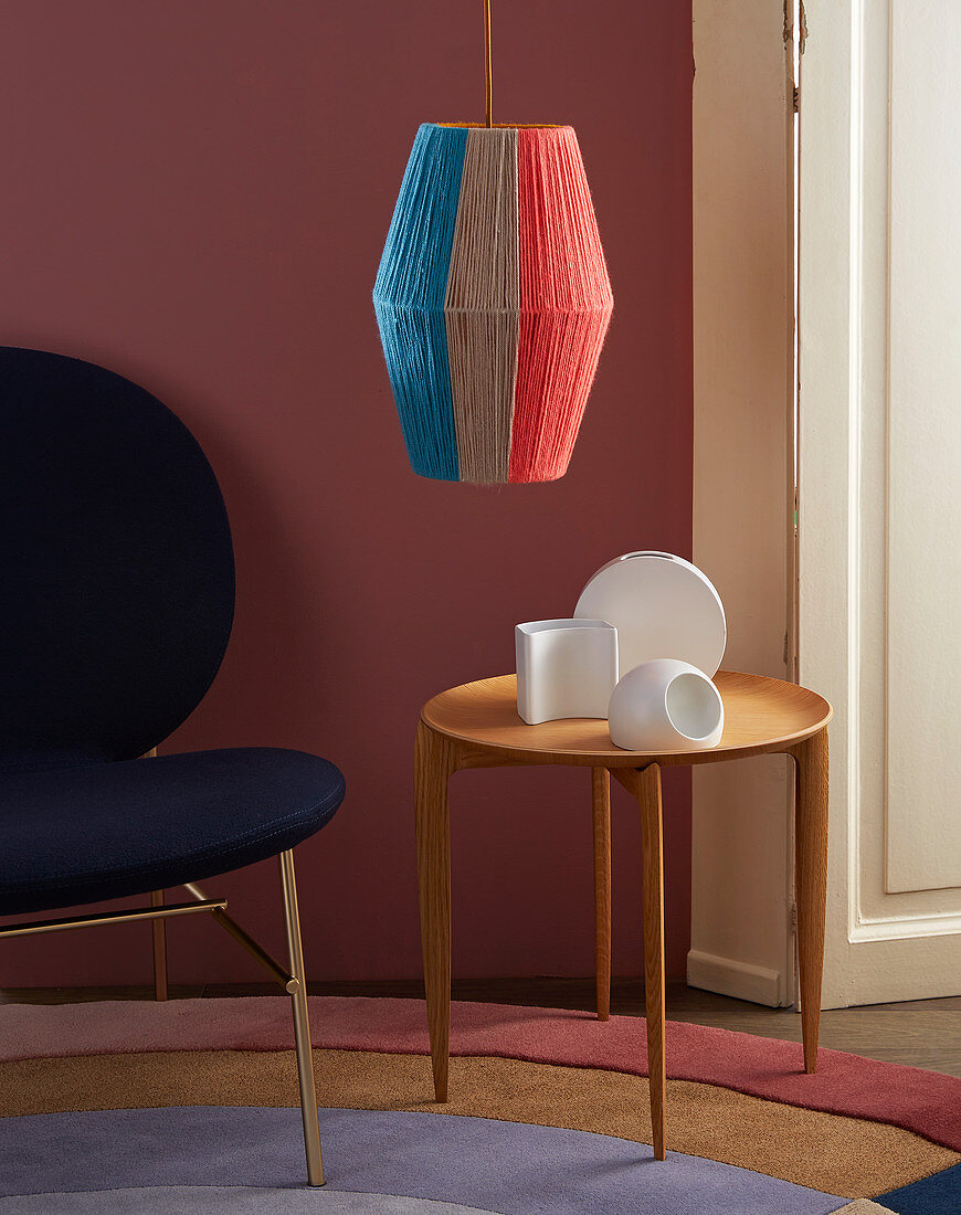 A DIY hanging lamp made of coloured wool