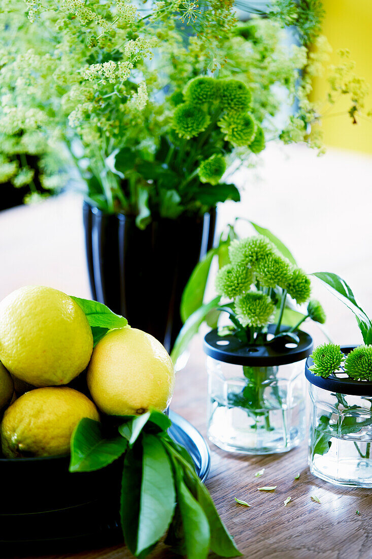An arrangement of lemons and flowers
