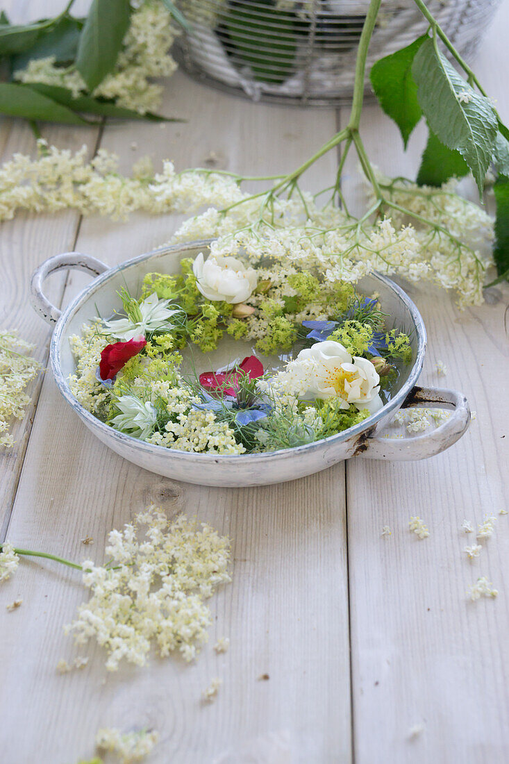 Wreath of elderflowers in a bowl