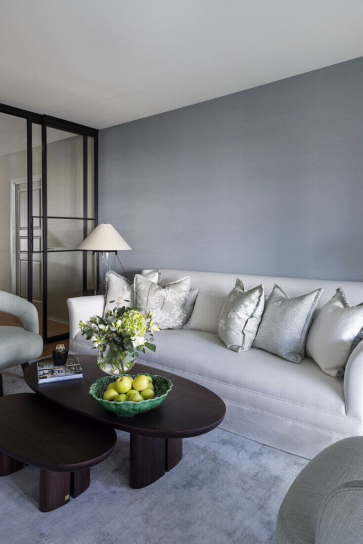 Elegant living room in grey tones, dark coffee table