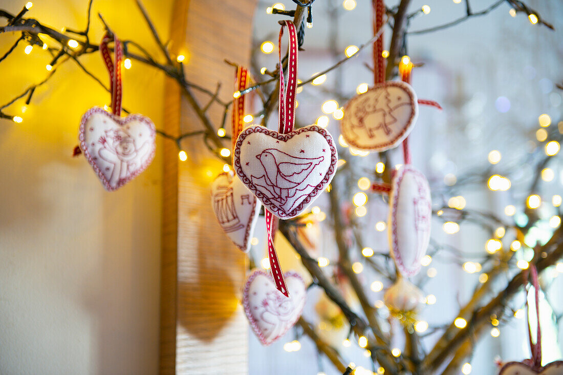 Fabric hearts with embroidery as Christmas tree ornaments