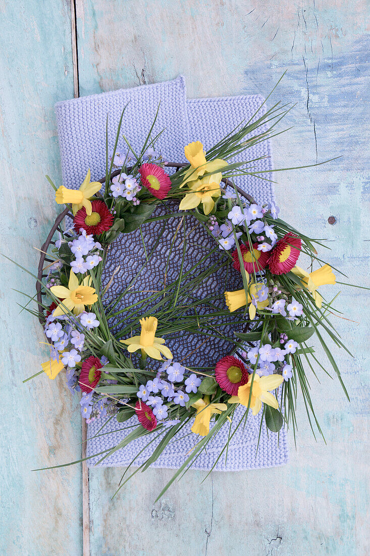 Wreath of daffodils, bellis, and forget me not