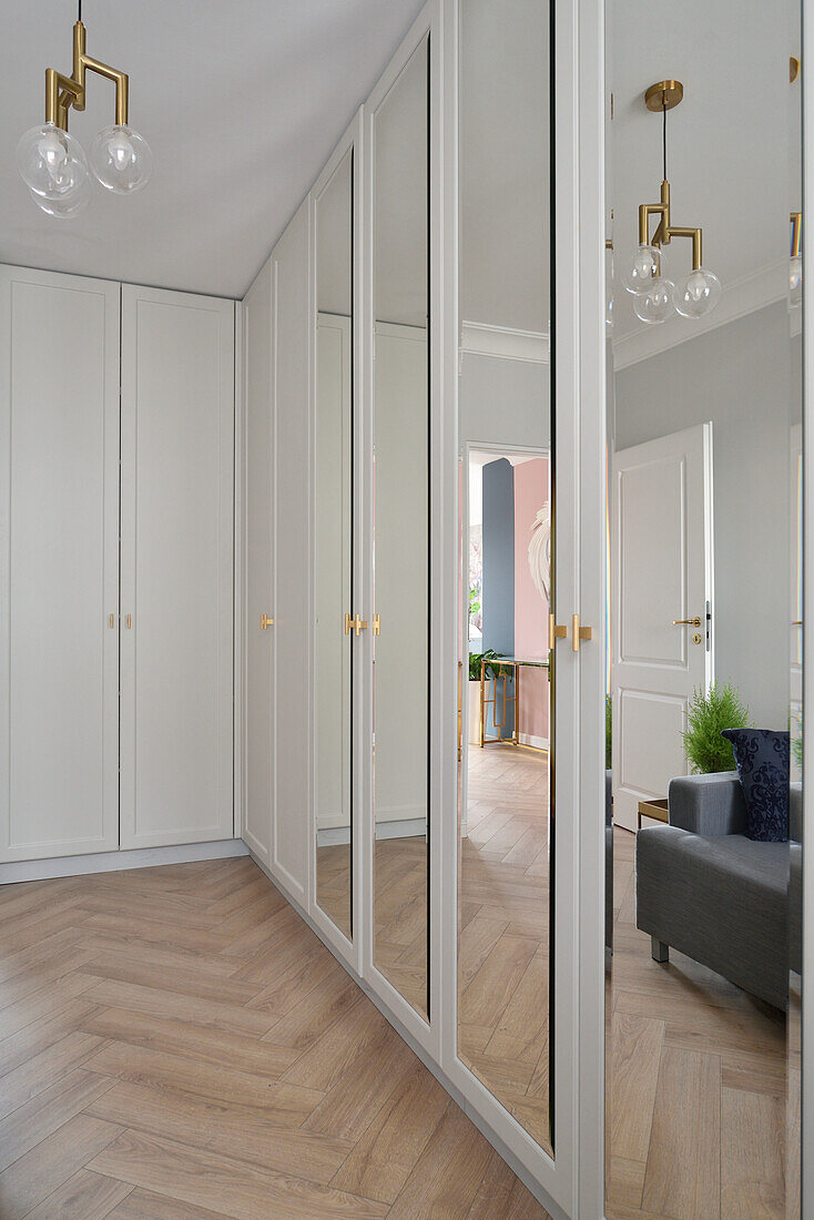 Floor-to-ceiling built-in wardrobes, some with mirrored doors