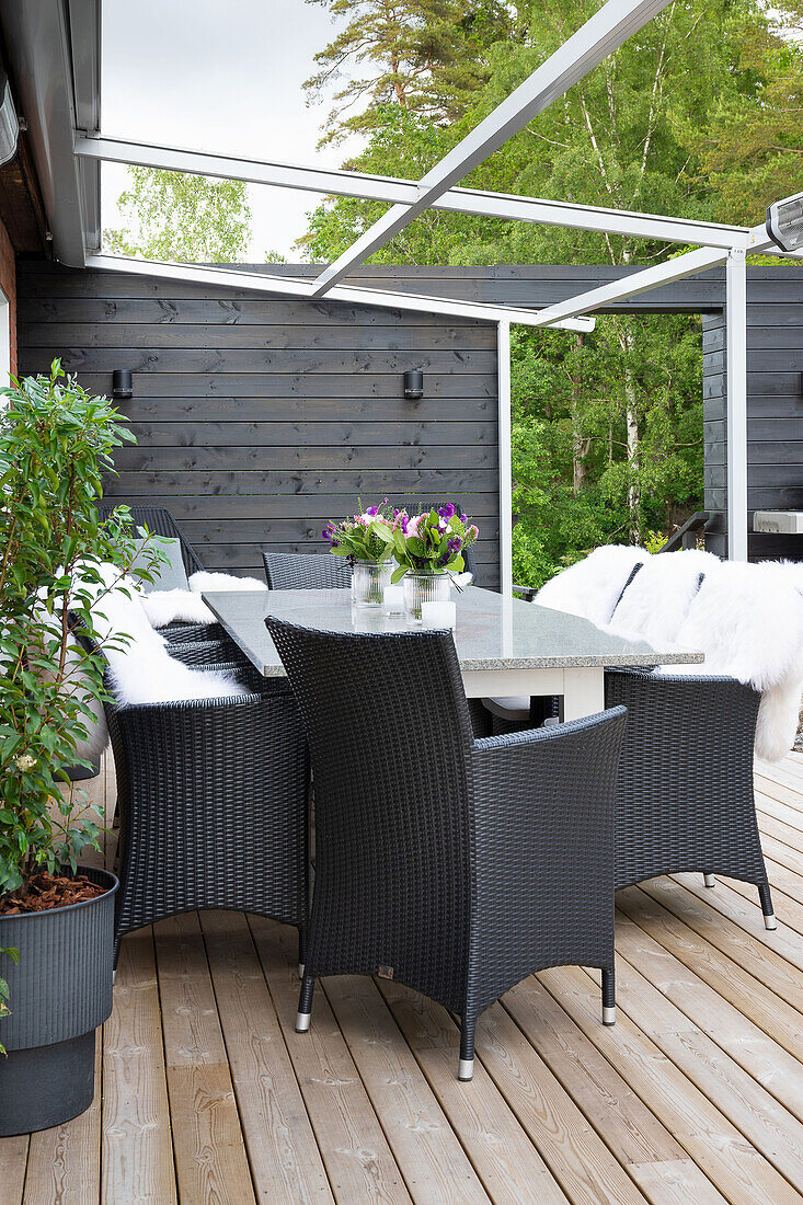 Elegant dining area on wooden terrace