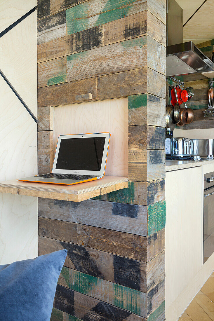 Small work counter on kitchen wall made of wooden crates