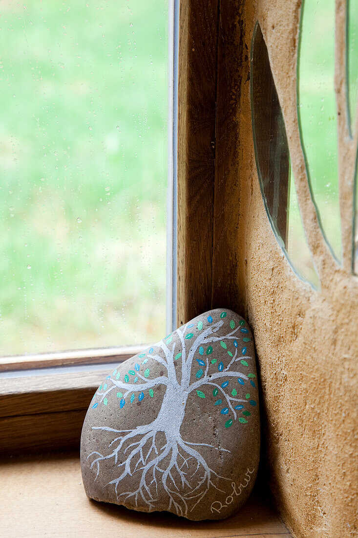 Painted stone with tree motif