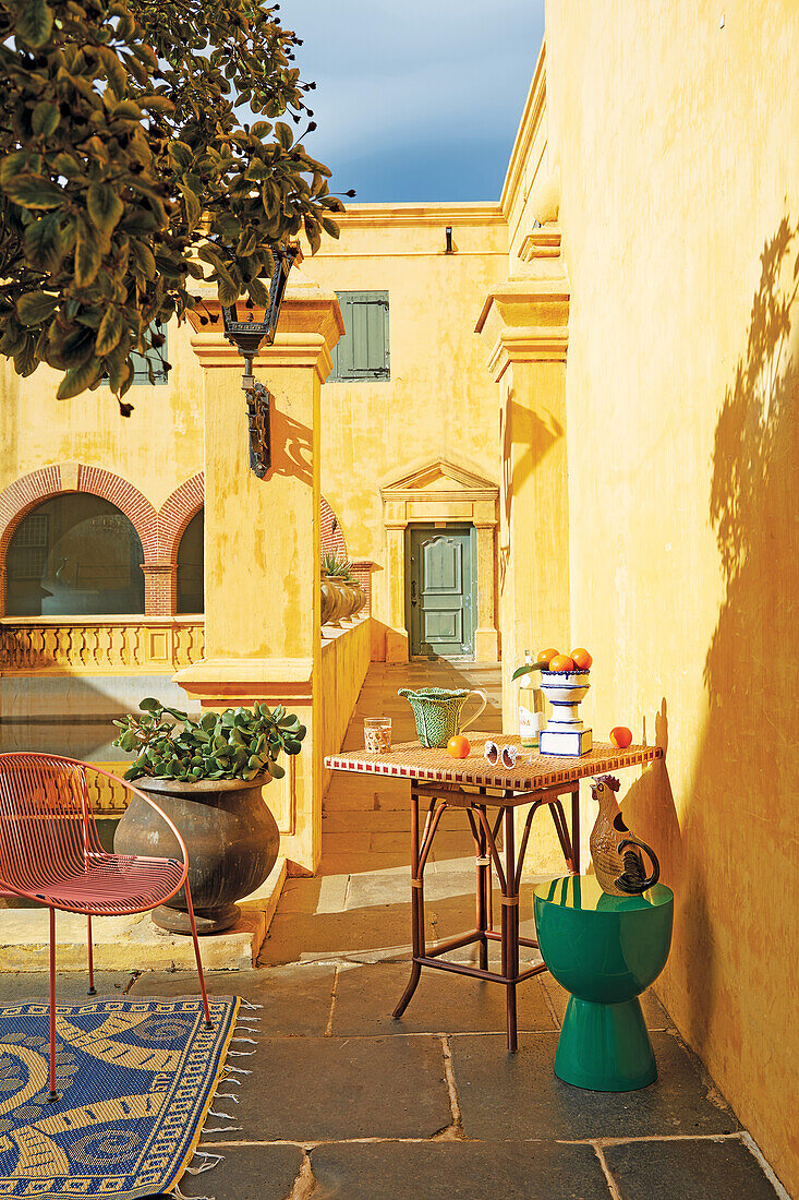 Light-flooded terrace with bistro table and chair