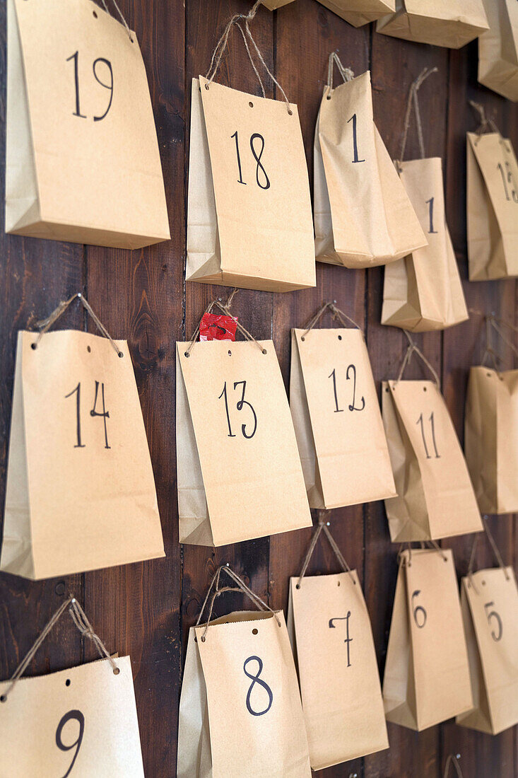Advent calendar made from paper bags on the wall