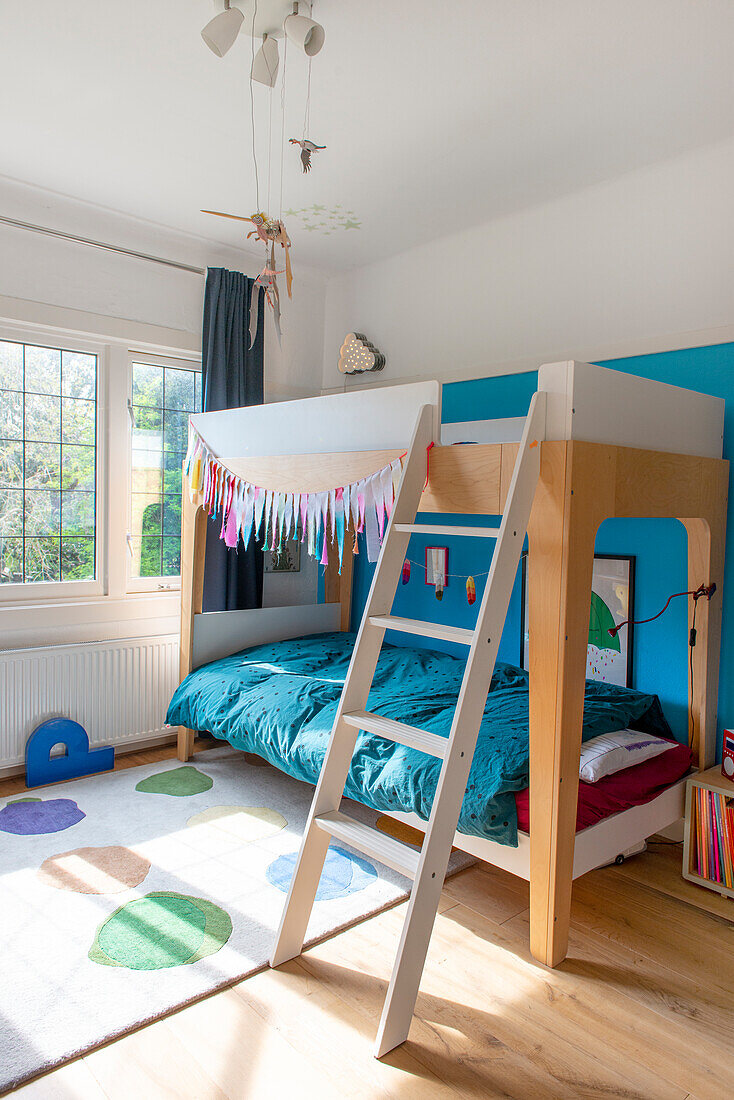 Loft bed with ladder in the children's room