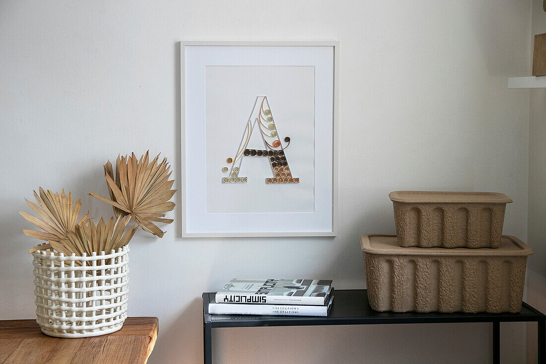 Minimalist living room with framed artwork and decor in earthy tones