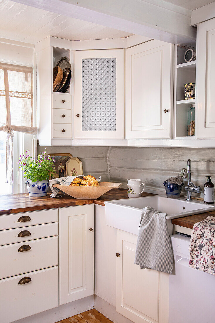 Country kitchen in white with wooden countertop