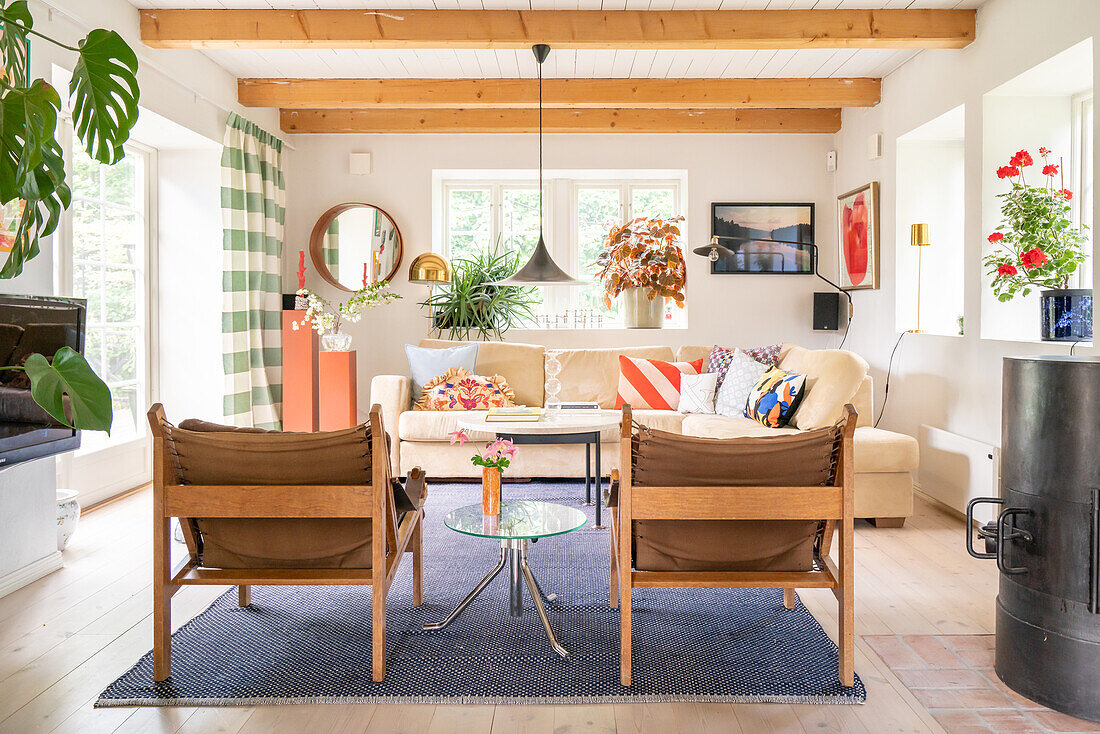 Bright living room with fireplace and colourful accents