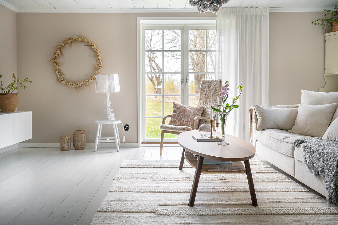 Bright living room with large windows, Scandinavian design, wooden details and plants