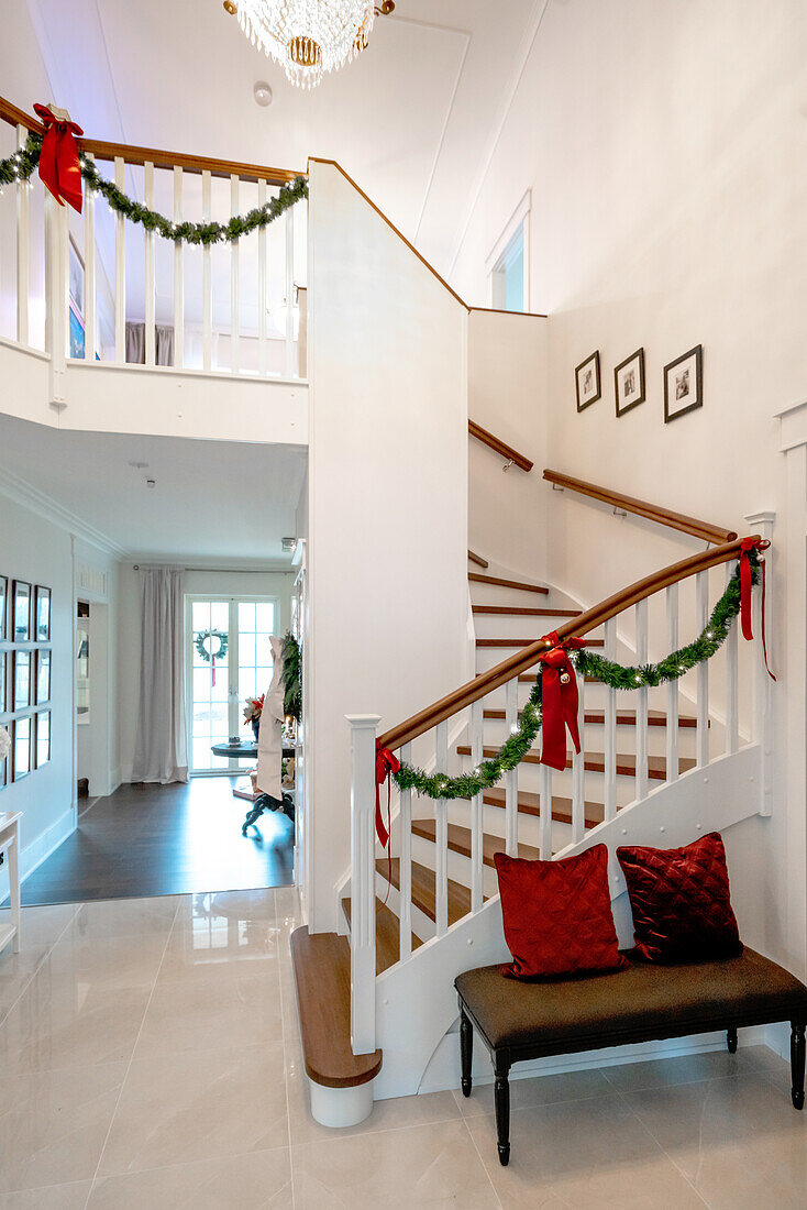 Staircase with Christmas decorations and bench in the entrance area