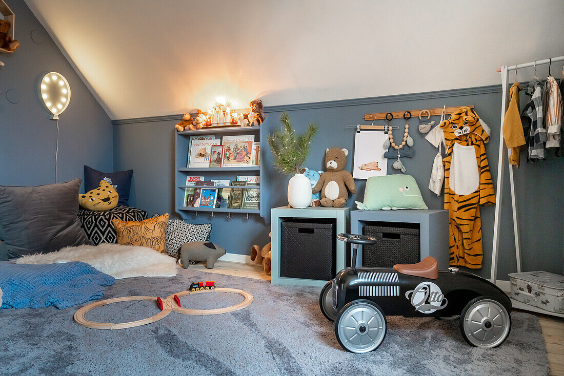 Children's room with bookshelf, wall decoration and retro slide car