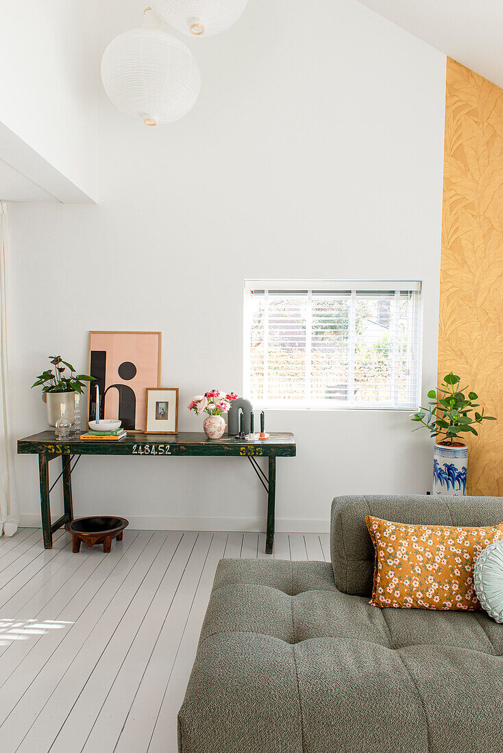 Bright living room with green table and decoration