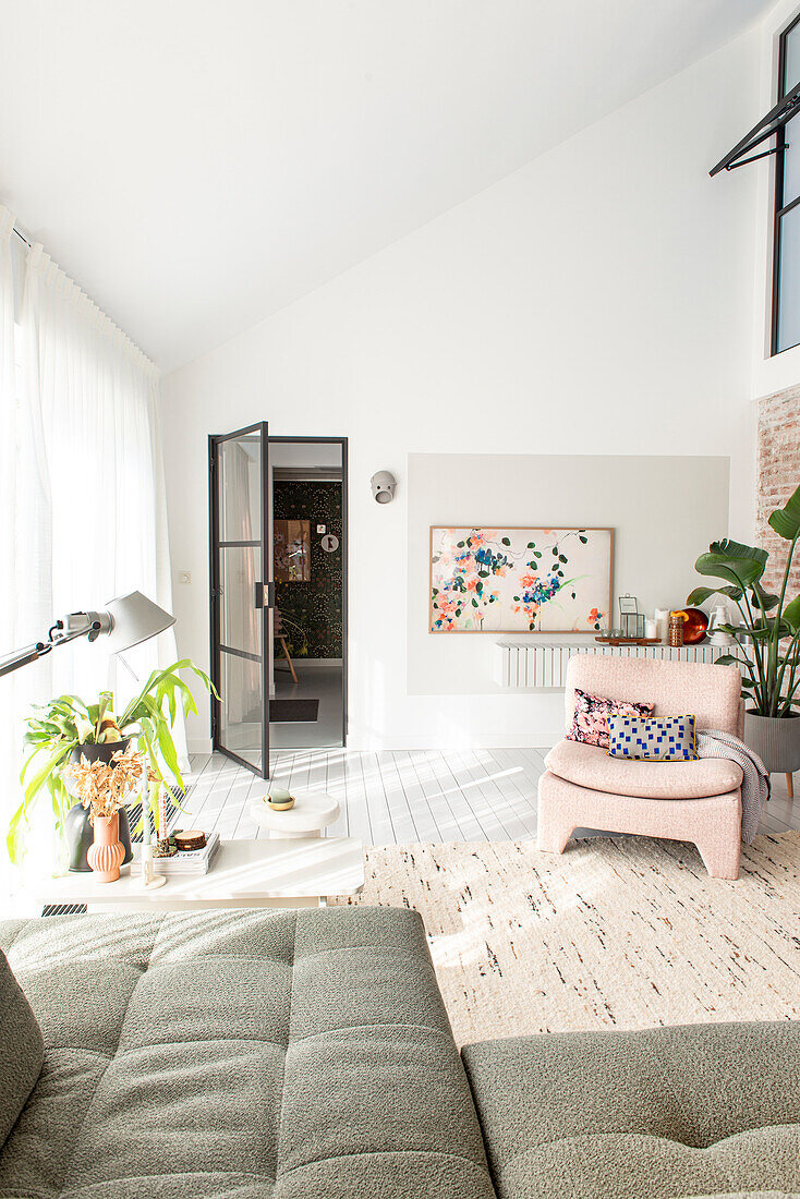 Bright, loft-like space with white walls and pastel accents